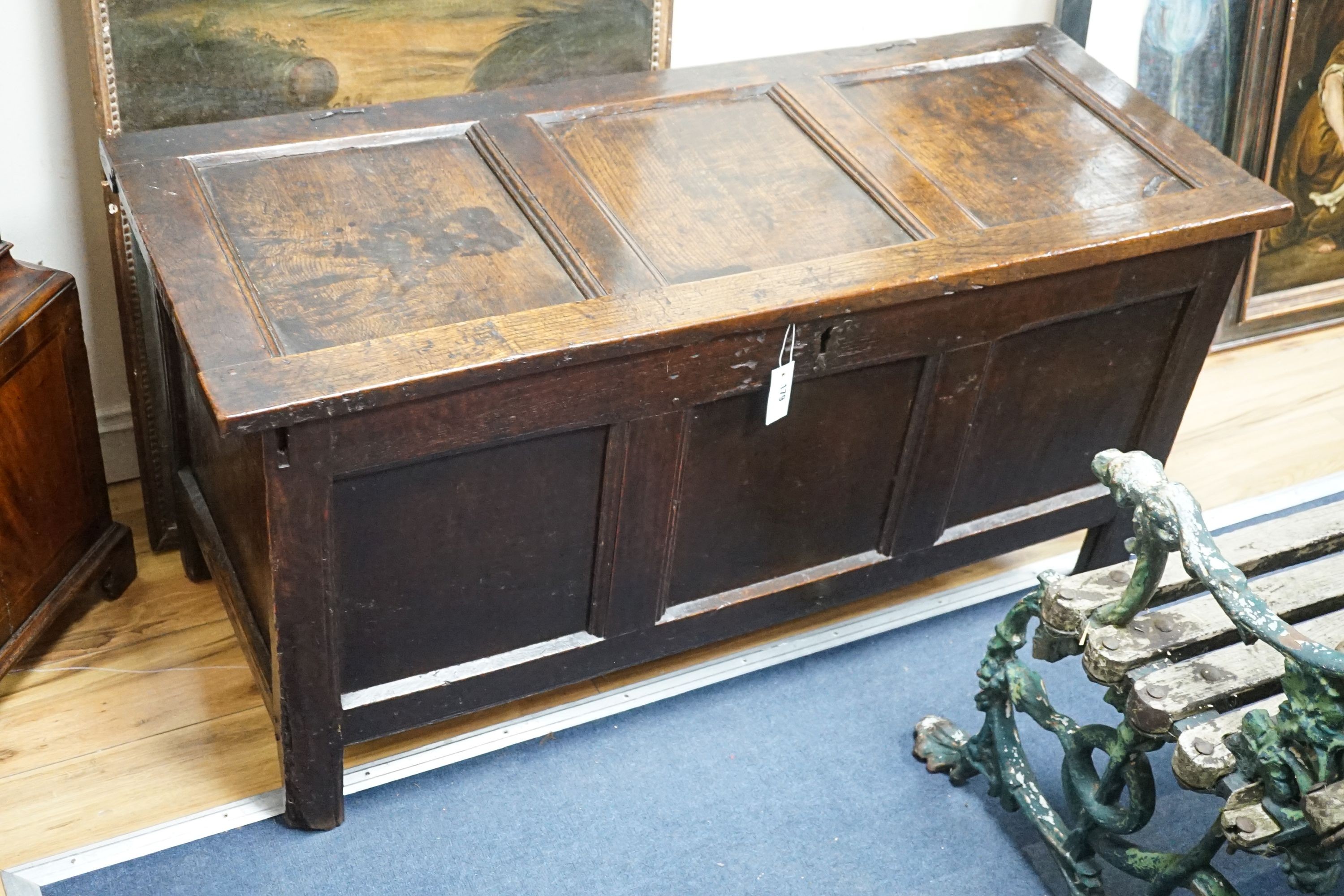 A late 17th century triple panelled oak coffer, length 126cm, depth 51cm, height 63cm